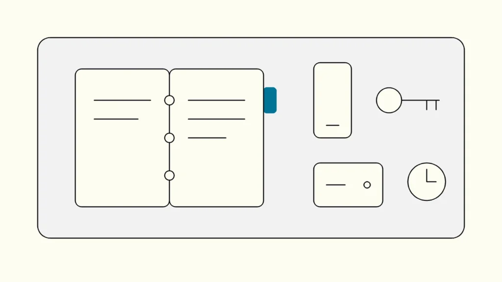 Line drawing of an open binder, a phone, a key and a backup drive laid out on a desk, with the binder tab in blue